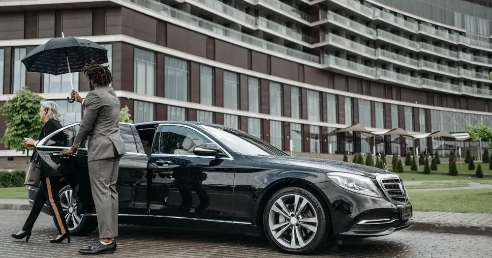 A private chauffeur welcoming a guest